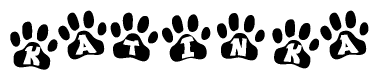 The image shows a series of animal paw prints arranged horizontally. Within each paw print, there's a letter; together they spell Katinka