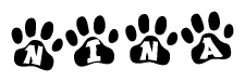 The image shows a row of animal paw prints, each containing a letter. The letters spell out the word Nina within the paw prints.