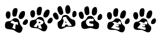 The image shows a row of animal paw prints, each containing a letter. The letters spell out the word Tracee within the paw prints.