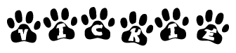 The image shows a series of animal paw prints arranged in a horizontal line. Each paw print contains a letter, and together they spell out the word Vickie.