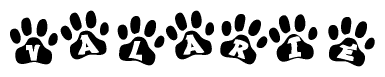 The image shows a series of animal paw prints arranged horizontally. Within each paw print, there's a letter; together they spell Valarie