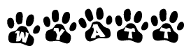 The image shows a row of animal paw prints, each containing a letter. The letters spell out the word Wyatt within the paw prints.