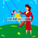 Mother pushing child on a swing