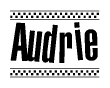 The image contains the text Audrie in a bold, stylized font, with a checkered flag pattern bordering the top and bottom of the text.