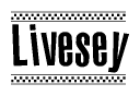 The image is a black and white clipart of the text Livesey in a bold, italicized font. The text is bordered by a dotted line on the top and bottom, and there are checkered flags positioned at both ends of the text, usually associated with racing or finishing lines.