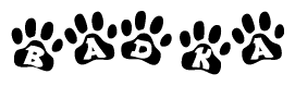 The image shows a series of animal paw prints arranged in a horizontal line. Each paw print contains a letter, and together they spell out the word Badka.