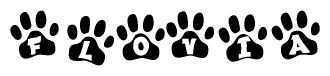 The image shows a row of animal paw prints, each containing a letter. The letters spell out the word Flovia within the paw prints.