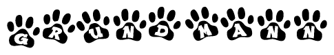 The image shows a series of animal paw prints arranged horizontally. Within each paw print, there's a letter; together they spell Grundmann