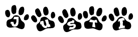 The image shows a series of animal paw prints arranged in a horizontal line. Each paw print contains a letter, and together they spell out the word Justi.