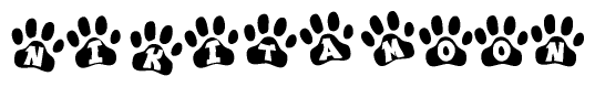 The image shows a series of animal paw prints arranged in a horizontal line. Each paw print contains a letter, and together they spell out the word Nikitamoon.