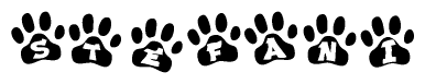 The image shows a series of animal paw prints arranged in a horizontal line. Each paw print contains a letter, and together they spell out the word Stefani.