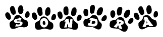 The image shows a series of animal paw prints arranged in a horizontal line. Each paw print contains a letter, and together they spell out the word Sondra.