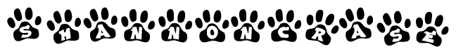 The image shows a series of animal paw prints arranged horizontally. Within each paw print, there's a letter; together they spell Shannoncrase