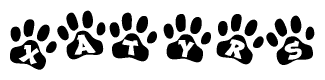 The image shows a series of animal paw prints arranged in a horizontal line. Each paw print contains a letter, and together they spell out the word Xatyrs.