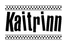 The image is a black and white clipart of the text Kaitrinn in a bold, italicized font. The text is bordered by a dotted line on the top and bottom, and there are checkered flags positioned at both ends of the text, usually associated with racing or finishing lines.