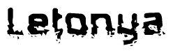 This nametag says Letonya, and has a static looking effect at the bottom of the words. The words are in a stylized font.
