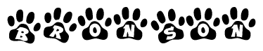 The image shows a series of animal paw prints arranged in a horizontal line. Each paw print contains a letter, and together they spell out the word Bronson.