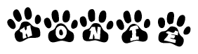 The image shows a series of animal paw prints arranged horizontally. Within each paw print, there's a letter; together they spell Honie
