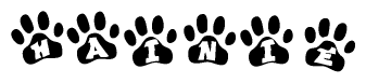 The image shows a series of animal paw prints arranged in a horizontal line. Each paw print contains a letter, and together they spell out the word Hainie.