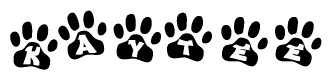 The image shows a row of animal paw prints, each containing a letter. The letters spell out the word Kaytee within the paw prints.