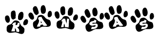 The image shows a row of animal paw prints, each containing a letter. The letters spell out the word Kansas within the paw prints.
