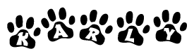 The image shows a series of animal paw prints arranged in a horizontal line. Each paw print contains a letter, and together they spell out the word Karly.