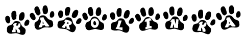 The image shows a row of animal paw prints, each containing a letter. The letters spell out the word Karolinka within the paw prints.