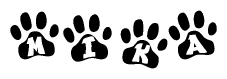 The image shows a series of animal paw prints arranged in a horizontal line. Each paw print contains a letter, and together they spell out the word Mika.