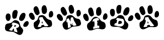The image shows a row of animal paw prints, each containing a letter. The letters spell out the word Ramida within the paw prints.