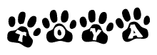 The image shows a row of animal paw prints, each containing a letter. The letters spell out the word Toya within the paw prints.