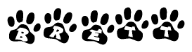The image shows a row of animal paw prints, each containing a letter. The letters spell out the word Brett within the paw prints.