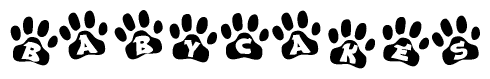 The image shows a row of animal paw prints, each containing a letter. The letters spell out the word Babycakes within the paw prints.