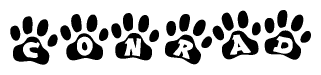 The image shows a series of animal paw prints arranged in a horizontal line. Each paw print contains a letter, and together they spell out the word Conrad.