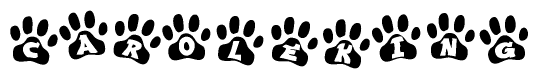 The image shows a row of animal paw prints, each containing a letter. The letters spell out the word Caroleking within the paw prints.