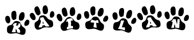 The image shows a row of animal paw prints, each containing a letter. The letters spell out the word Kaitlan within the paw prints.