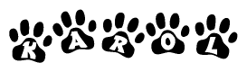 The image shows a series of animal paw prints arranged horizontally. Within each paw print, there's a letter; together they spell Karol