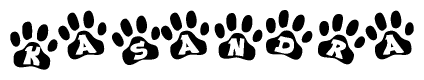 The image shows a series of animal paw prints arranged horizontally. Within each paw print, there's a letter; together they spell Kasandra