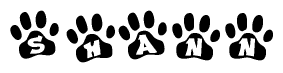 The image shows a series of animal paw prints arranged horizontally. Within each paw print, there's a letter; together they spell Shann