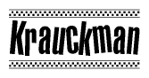 The image is a black and white clipart of the text Krauckman in a bold, italicized font. The text is bordered by a dotted line on the top and bottom, and there are checkered flags positioned at both ends of the text, usually associated with racing or finishing lines.