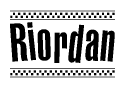 The clipart image displays the text Riordan in a bold, stylized font. It is enclosed in a rectangular border with a checkerboard pattern running below and above the text, similar to a finish line in racing. 