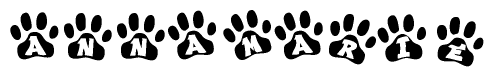 The image shows a series of animal paw prints arranged in a horizontal line. Each paw print contains a letter, and together they spell out the word Annamarie.