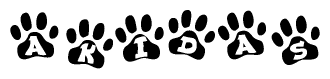 The image shows a row of animal paw prints, each containing a letter. The letters spell out the word Akidas within the paw prints.