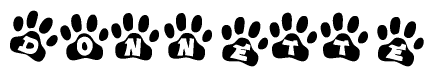 The image shows a series of animal paw prints arranged in a horizontal line. Each paw print contains a letter, and together they spell out the word Donnette.