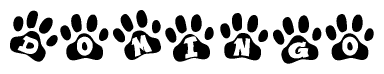 The image shows a series of animal paw prints arranged horizontally. Within each paw print, there's a letter; together they spell Domingo