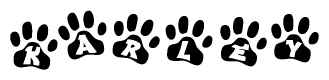 The image shows a series of animal paw prints arranged in a horizontal line. Each paw print contains a letter, and together they spell out the word Karley.