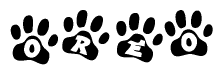 The image shows a row of animal paw prints, each containing a letter. The letters spell out the word Oreo within the paw prints.