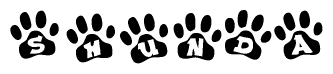 The image shows a row of animal paw prints, each containing a letter. The letters spell out the word Shunda within the paw prints.