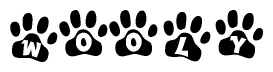 The image shows a series of animal paw prints arranged in a horizontal line. Each paw print contains a letter, and together they spell out the word Wooly.