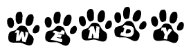 The image shows a series of animal paw prints arranged in a horizontal line. Each paw print contains a letter, and together they spell out the word Wendy.