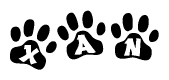 The image shows a series of animal paw prints arranged in a horizontal line. Each paw print contains a letter, and together they spell out the word Xan.